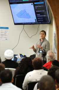 Erin Carey, neighborhood planner for the City of Erie, addresses a crowd of more than 50 people, on May 18, 2023, at the Urban Erie Community Development Corp.'s Quality of Life Learning Center, during a preseentation of the Buffalo Road Neighborhood Plan, which covers the east Erie area where the UECDC is located. 